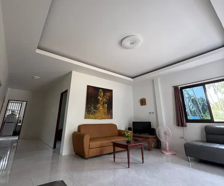 The bright, tiled living room of the guesthouse
